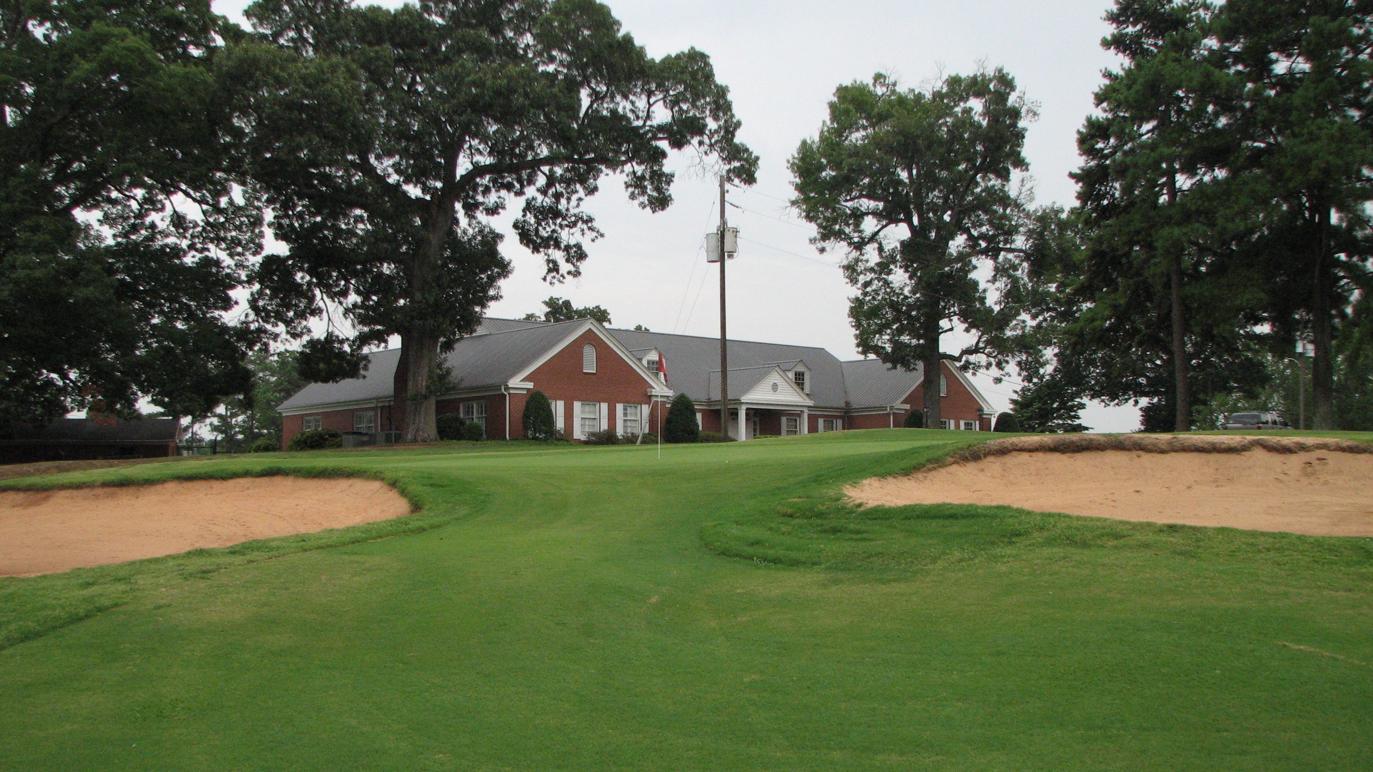 green with clubhouse in the background